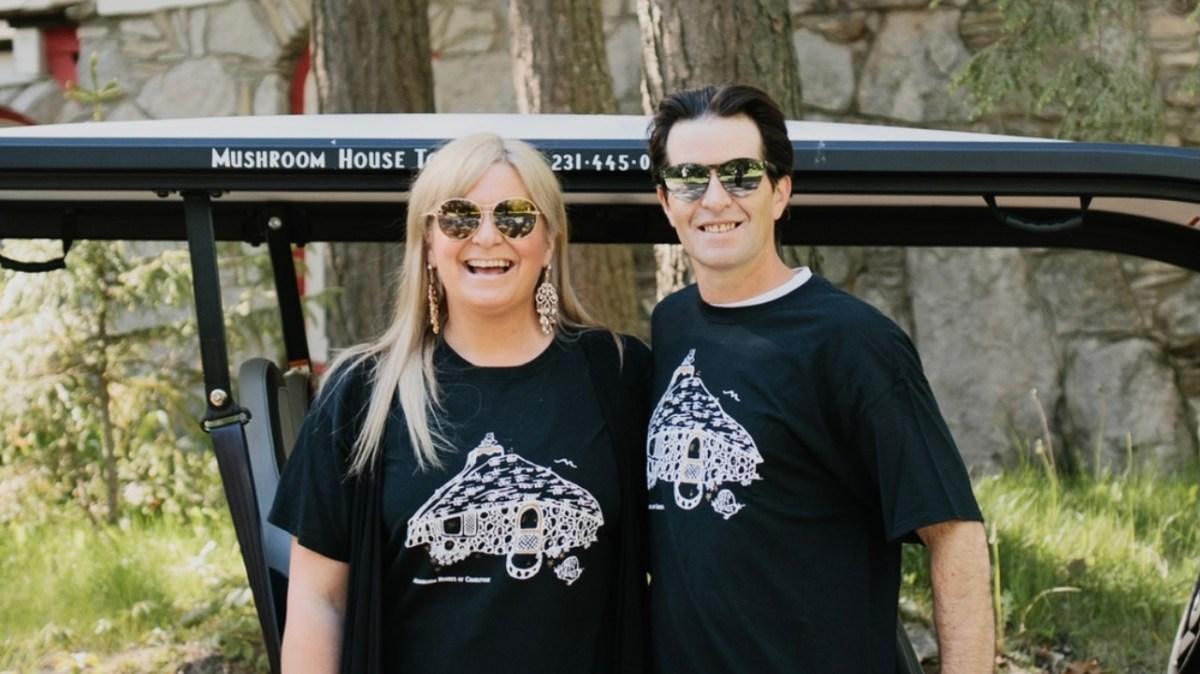 alex and edith pro pic a person standing in front of a group of people posing for the camera