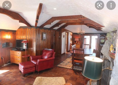 a room filled with furniture on top of a wooden table